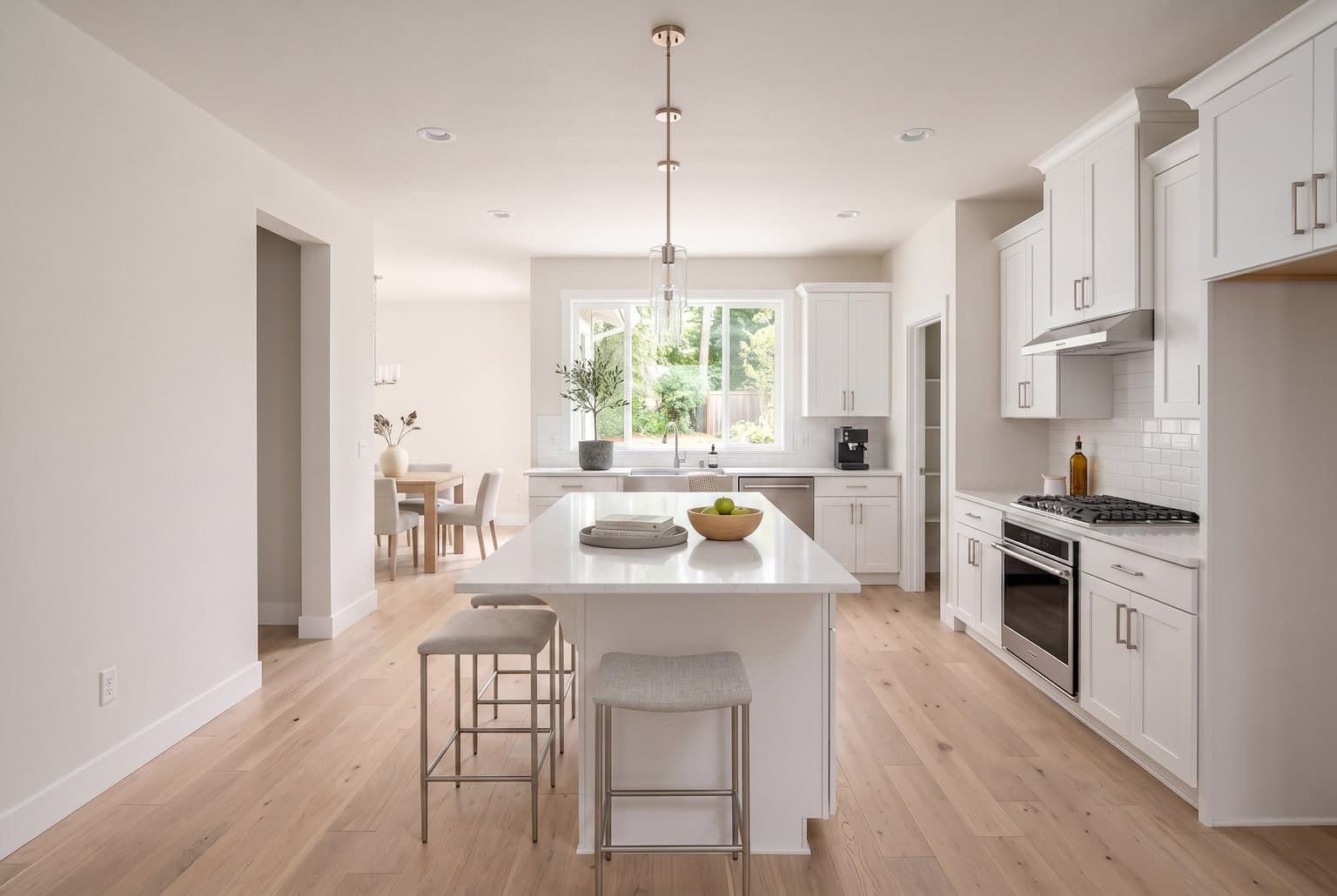 Kitchen after AI virtual staging with bar stools and decor